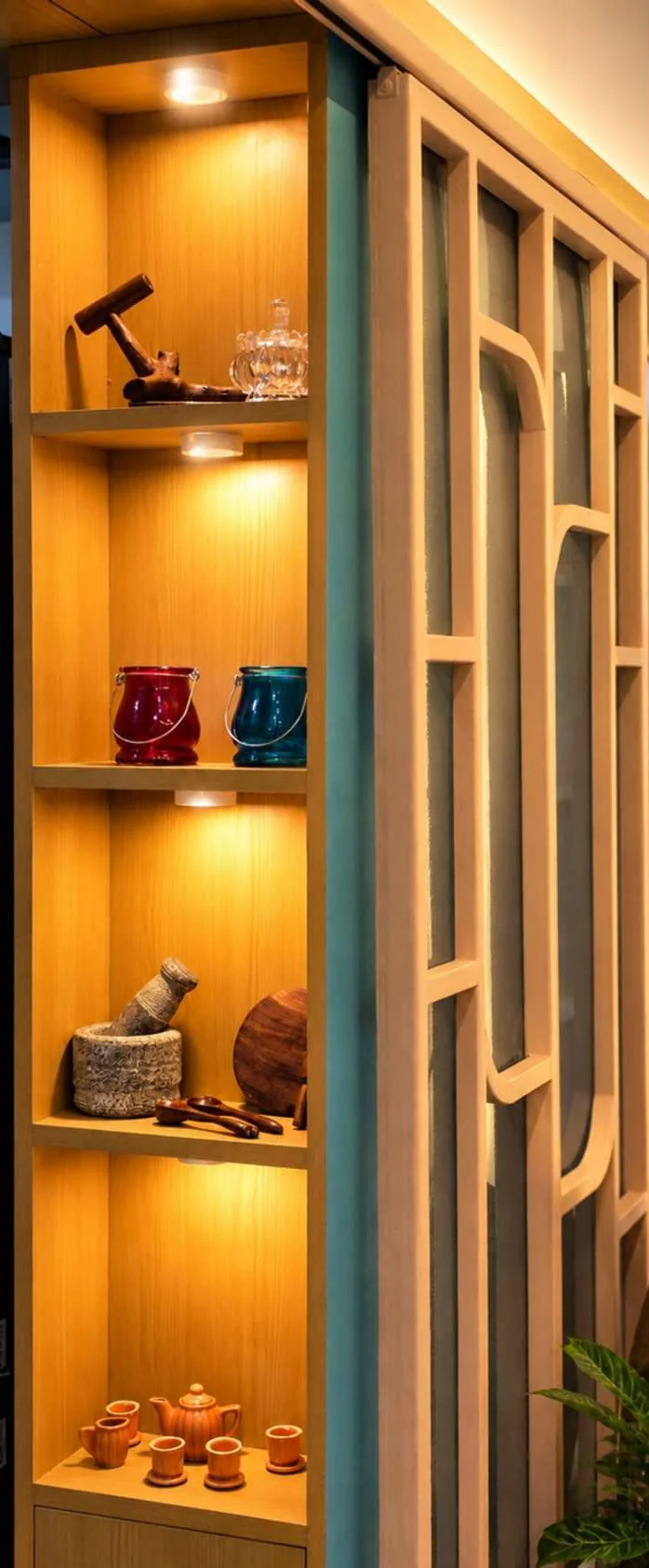 Warmly lit timber display shelving and architectural joinery